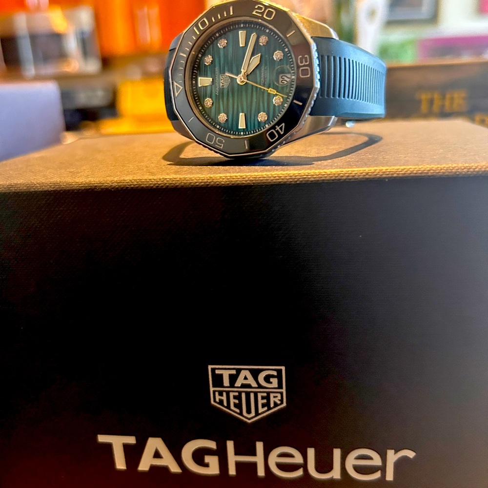 Tag Heuer Aquaracer woman’s watch. Brand new and has all the paper paperwork.